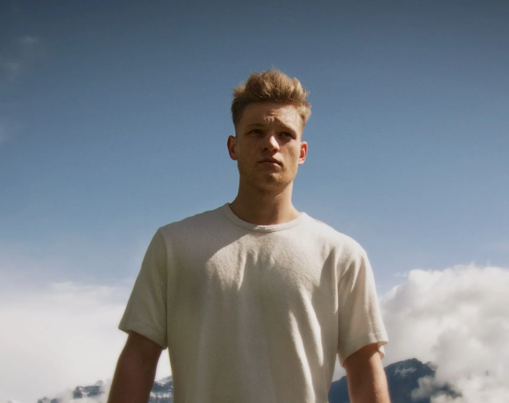 Portrait of Lukas Goss against a blue sky